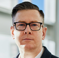 Foto de Alexander Hughes, executivo e CEO de uma empresa de negociação de criptomoedas